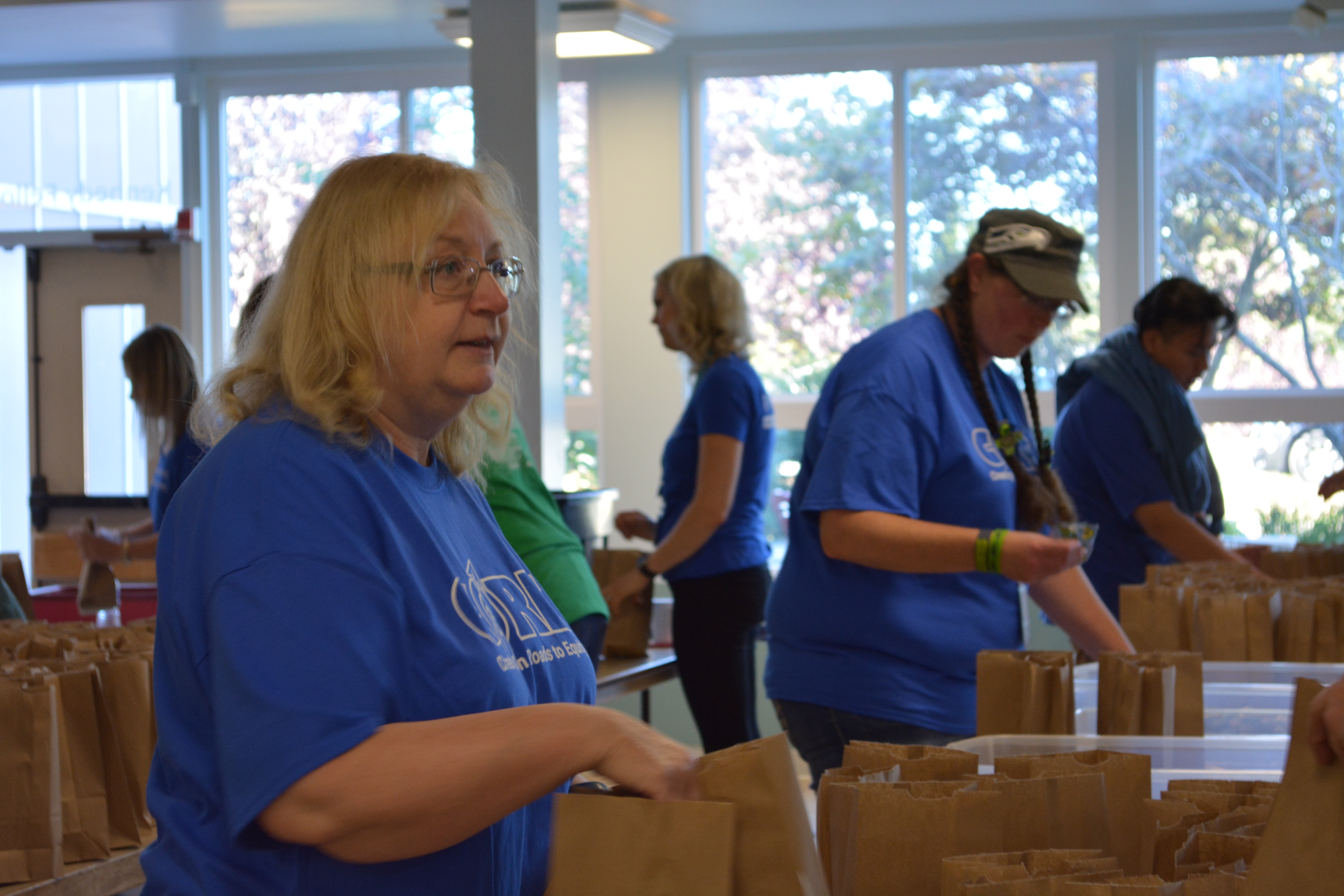 Volunteers packing snack kits for Washington Kids in Transition