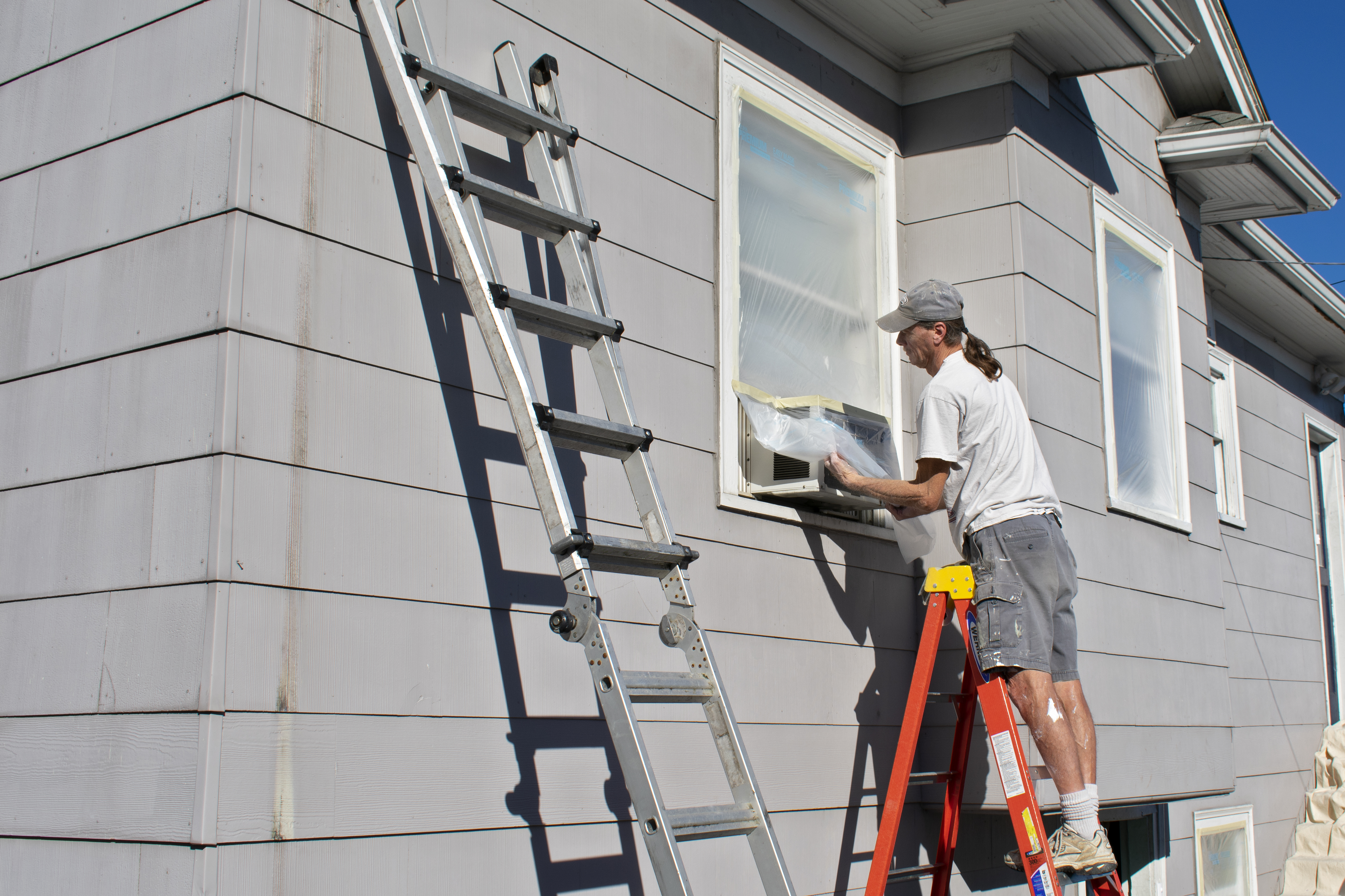 Volunteers painting Homeward House