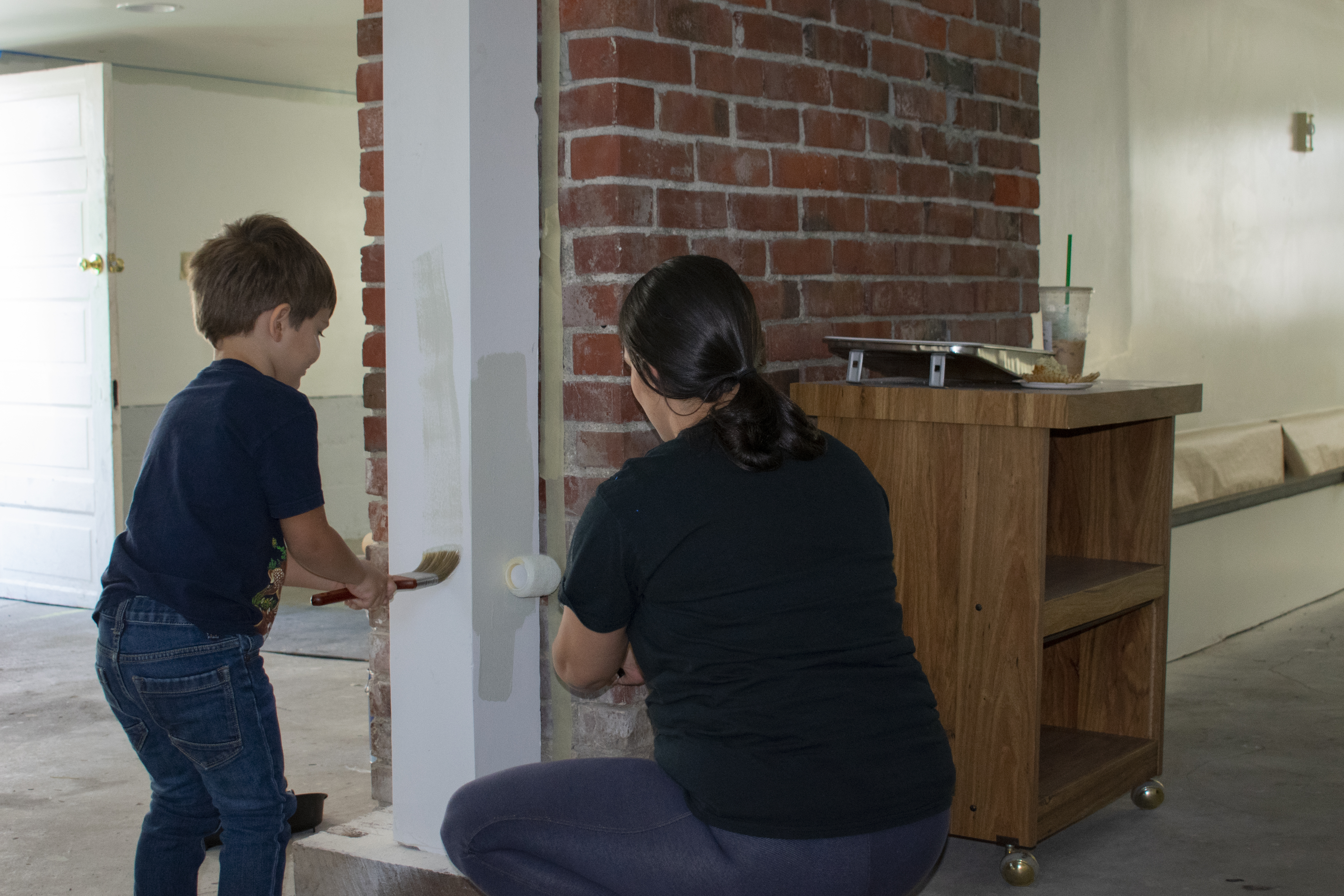 Volunteers painting Homeward House